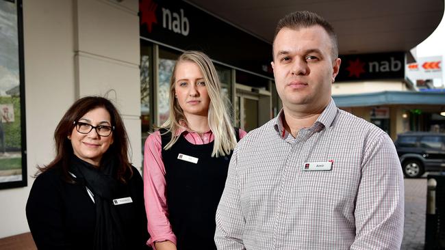 CONCERNED: NAB Torrensville staff Theodora Papayianis, Tia Wyatt and Amir Beganovic said they felt the Government was attacking them. Picture: Bianca De Marchi