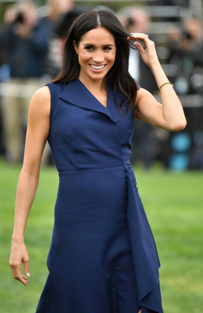 Meghan, in her Very Special Dion Lee dress that’s not even on sale yet.