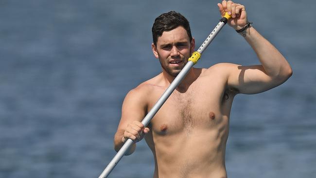 McCartin tries some stand-up paddleboarding during a St Kilda session. Picture: Getty Images