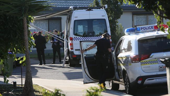 Police and crime-scene investigators at the scene of the Woodville West house fire. Picture: Emma Brasier.