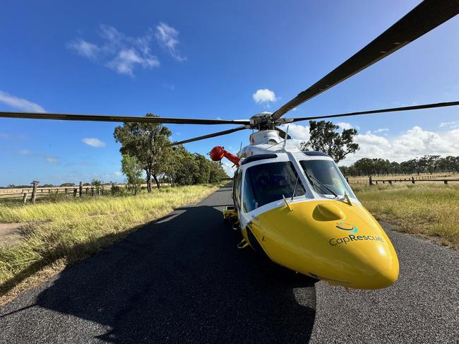 CapRescue lands near an accident at Greenlake Rd, Sandringham to help treat a young man who became trapped when his car rolled and collided with a tree on February 27, 2025, leaving him with life-threatening injuries.