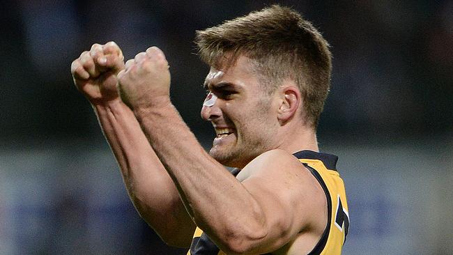 Richmond's Anthony Miles celebrates a goal in the second term