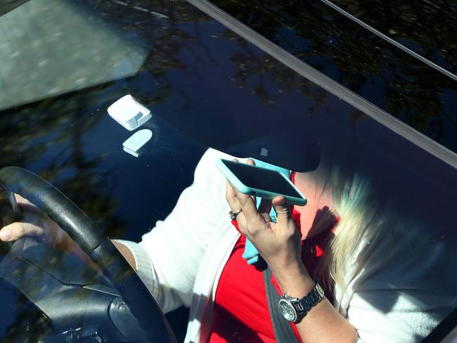 This woman was snapped using her phone while driving. Picture: Liam Kidston