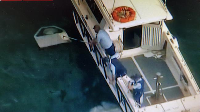 A picture of officers on the Launch Brooklyn boat after the tragedy.