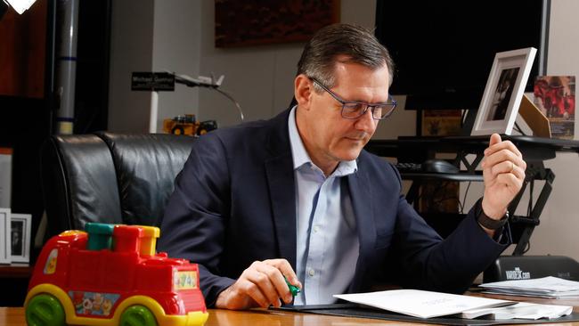 Chief Minister Michael Gunner leafing through budget papers. Picture: Glenn Campbell