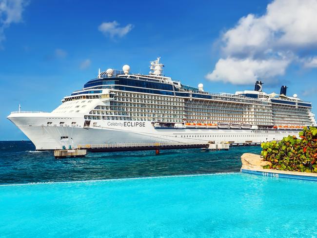 WILLEMSTAD, CURACAO - APRIL 10, 2018: View from infinity pool on Cruise ship Celebrity Eclipse docked at port Willemstad.