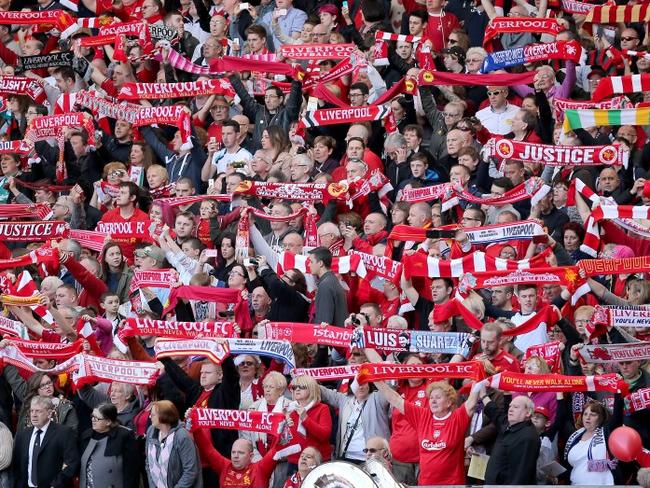 LIVERPOOL, ENGLAND - APRIL 15: Liverpool fans sing 'You'll Never Walk Alone' during the Hillsborough memorial service marking the 25th anniversary of the Hillsborough Disaster at Anfield stadium on April 15, 2014 in Liverpool, England. Thousands of fans, friends and relatives took part in the service at Liverpool's Anfield stadium to mark the 25th anniversary of the Hillsborough disaster. Bells across the City of Liverpool rung during a one minute silence. A total of 96 Liverpool supporters lost their lives during a crush at an FA Cup semi final against Nottingham Forest at the Hillsborough football ground in Sheffield, South Yorkshire in 1989. (Photo by Christopher Furlong/Getty Images)