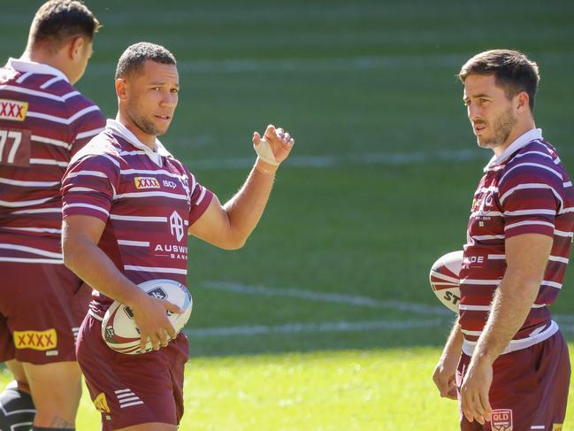 Maroons players Moses Mbye and Ben Hunt during the Captain's Run at Suncorp Stadium prior to Origin 1. Picture: AAP Image/Glenn Hunt