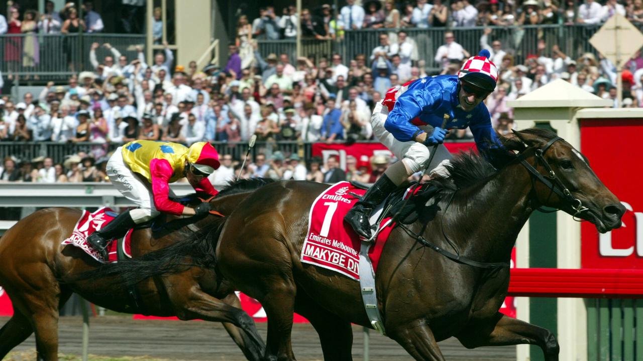 Glen Boss guides Makybe Diva to a historic third straight Melbourne Cup victory.
