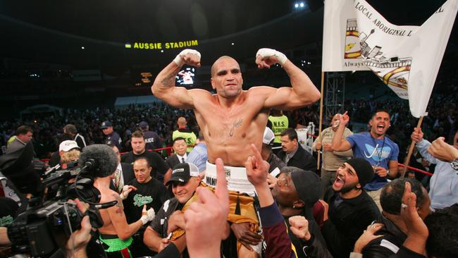 Anthony Mundine, riding on supporters' shoulders, celebrating victory over Danny Green 11 years ago.