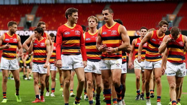 Crows players walk off after the loss to the Tigers. Picture: Brendon Thorne/Getty Images