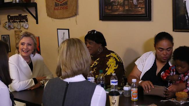 Hillary Clinton meets with supporters at Reed's Coffee and Tea House in Philadelphia / AFP