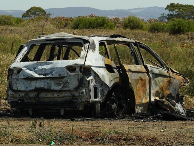 MELBOURNE AUSTRALIA - NewsWire Photos JANUARY 10, 2024: The getaway vehicle from a fatal shooting in Caroline Springs is seen torched on Beattys Road in Fraser Rise. Picture: NewsWire / Luis Enrique Ascui