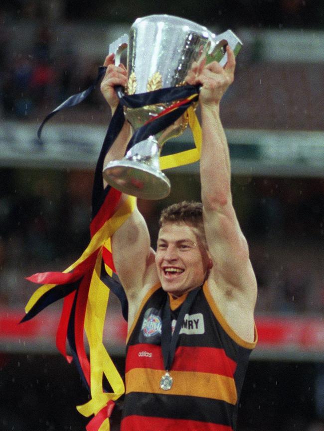 Skipper Mark Bickley holds the 1997 premiership cup aloft.