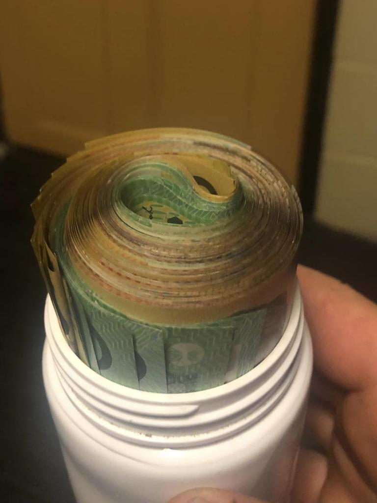 Jesse Stewart, who runs Get It Gone Rubbish Removal in Brisbane, found $7000 in a plastic medicine bottle full of cash while discarding an entertainment unit at a tip. Picture: Facebook