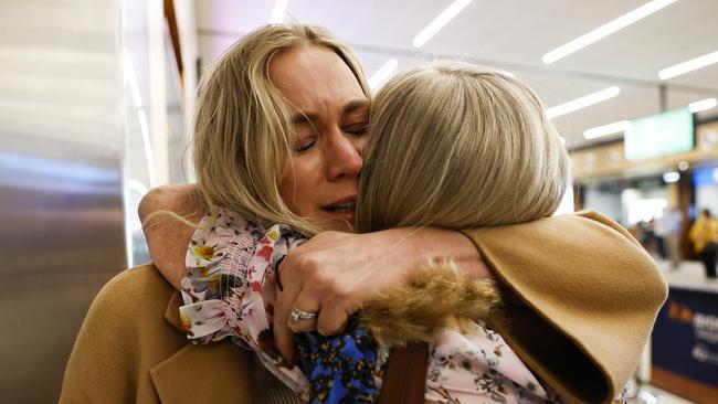 Amanda Osuchowski is reunited with her mum Kerry Stallard after arriving on the first flight from Melbourne at Hobart airport after the borders reopened to Victoria today. Picture: Zak Simmonds