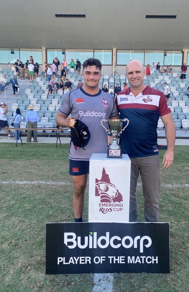 Hooker Aiden Luke being presented his man of the match medal by Sam Cordingley, QRU General Manager Professional Rugby, after scoring four tries for the Brisbane Grey Under-16s on day one of the Emerging Reds Cup.