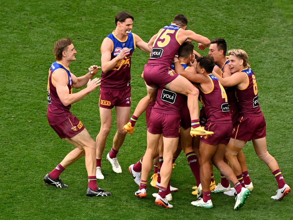 Jubilant Lions players congratulate Joe Daniher after his final-quarter goal in Brisbane’s 60-point win over Sydney at the MCG. Picture: Adam Trafford/AFL Photos via Getty Images