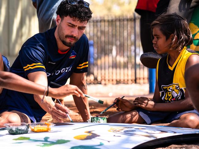 Adelaide’s Izak Rankine have been making the most of their off-season, travelling to the Anangu Pitjantjatjara Yankunytjatjara (APY) Lands this week to inspire hundreds of children and youth to get excited about maths and science. Picture: AFC