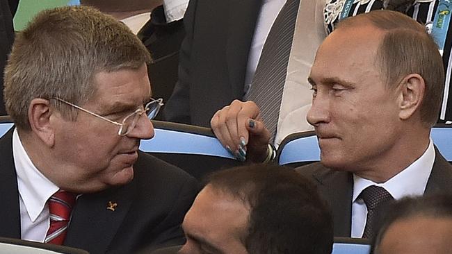 IOC President Thomas Bach (left) with Russian President Vladimir Putin.