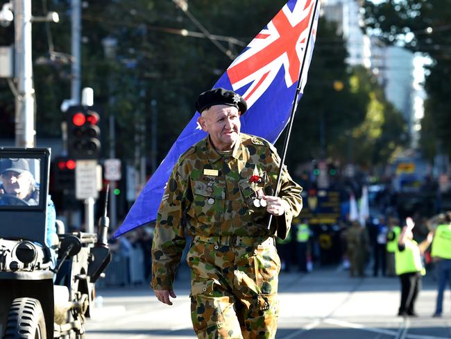 Veterans march to the Shrine of Remembrance for the Anzac Day march in Melbourne, Monday, April 25, 2016. (AAP Image/Tracey Nearmy) NO ARCHIVING