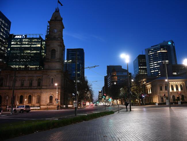 A near-deserted top of Victoria Square, looking north up King William Street, ten minutes before the 6pm lockdown Tuesday, July 20. Picture Mark Brake