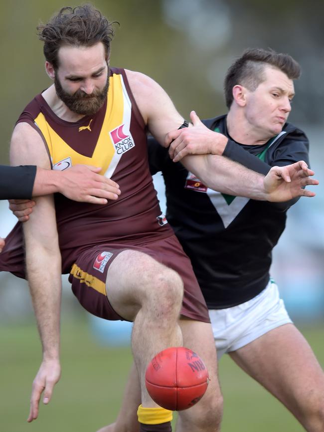 Ryan Henderson gets a kick away. Picture: Steve Tanner