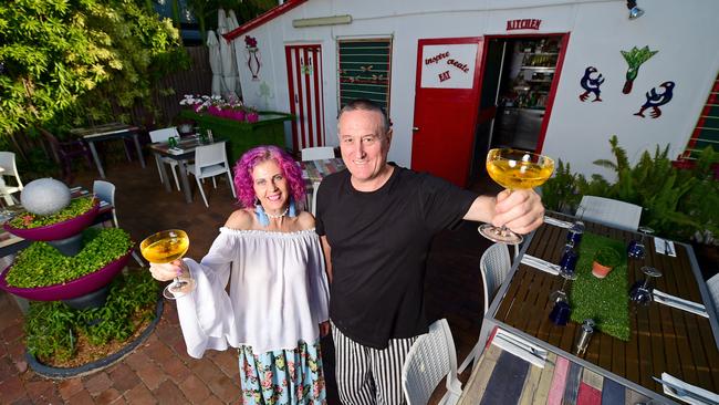 Wayne Gilray and Adele Scott together in the garden courtyard of their restaurant 'Garden of Eating'.