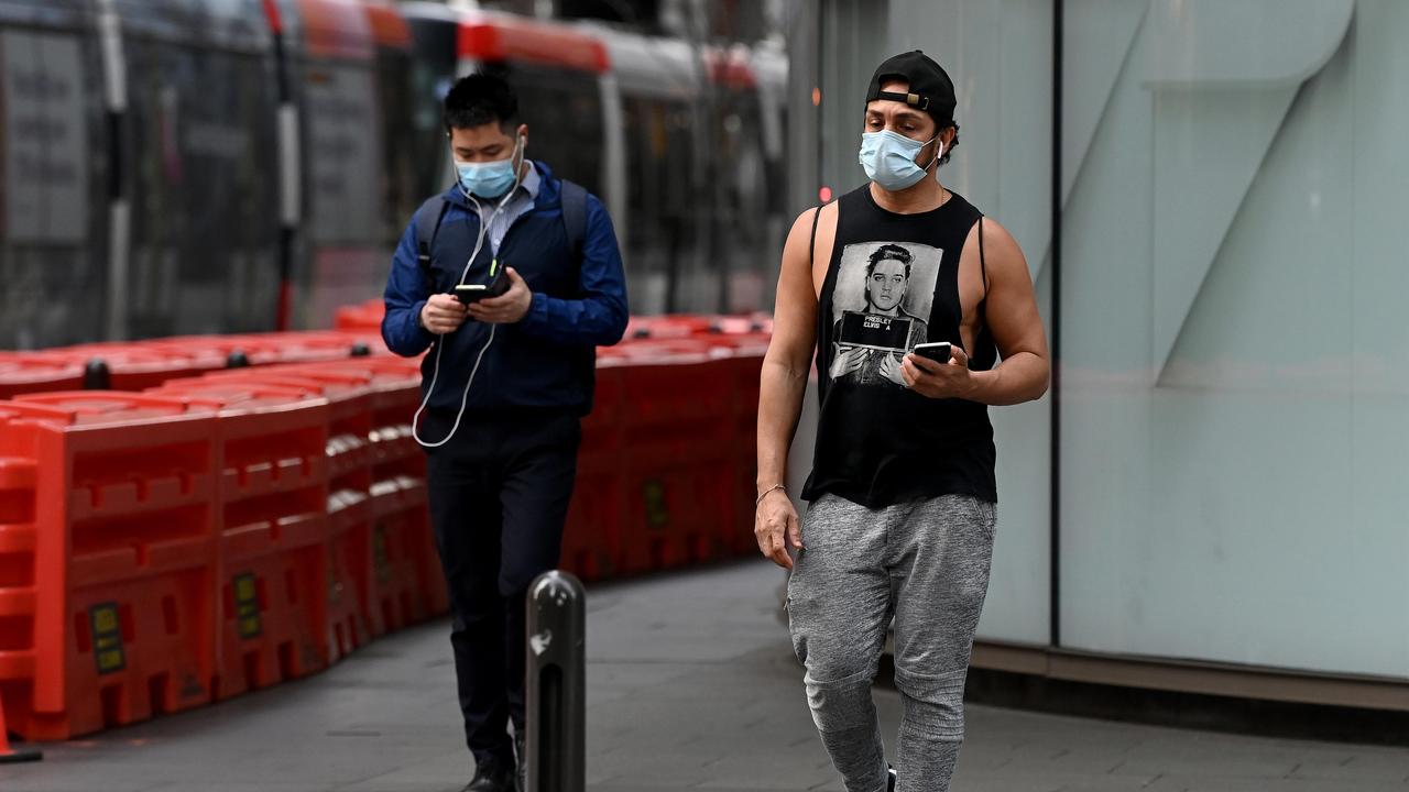 People wear masks during last year’s lockdown in Sydney. Picture: NCA NewsWire/Bianca De Marchi