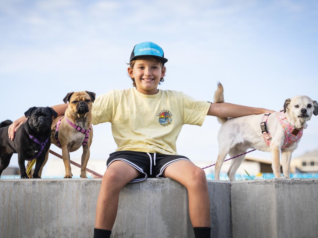 Kobe Stroem with his dogs (from left) Pickles, Waffles and Chilli, after Pickles and Waffles competed in the dock diving at the Toowoomba Royal Show, Friday, March 31, 2023. Picture: Kevin Farmer