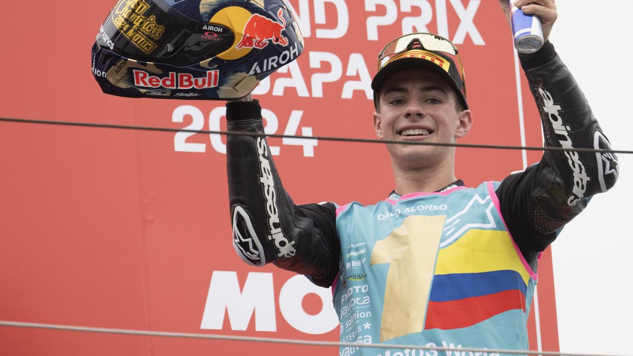 MOTEGI, JAPAN - OCTOBER 06: David Alonso of Colombia and CFMOTO Aspar Team celebrates the victory on the podium and the victory of 2024 Moto3 World Championship during the Moto3 race during the MotoGP Of Japan - Race at Twin Ring Motegi on October 06, 2024 in Motegi, Japan. (Photo by Mirco Lazzari gp/Getty Images)