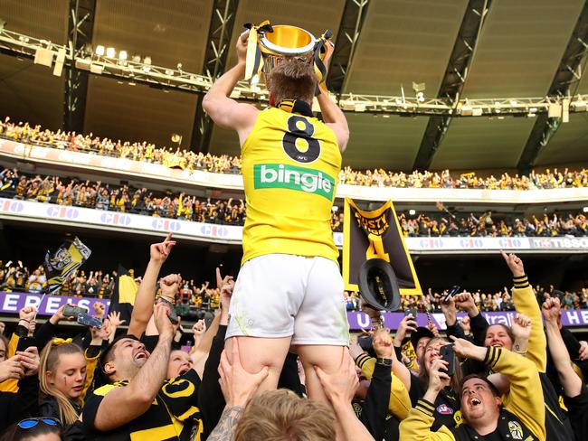 Jack Riewoldt celebrates with fans after winning the 2017 AFL Grand Final at the MCG.