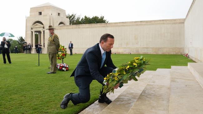 Tony Abbott lays a wreath during his visit to the Australian National Memorial in Villers-Brettoneux, France. Picture: Jake Nowakowski