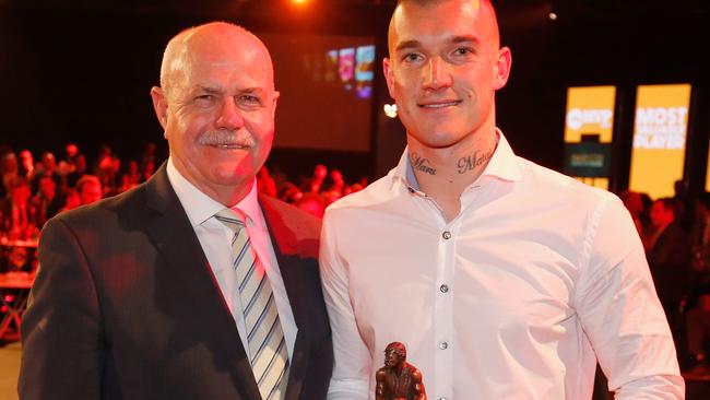 MELBOURNE, AUSTRALIA - SEPTEMBER 12:  Dustin Martin of the Tigers poses for a photo with Leigh Matthews after winning the AFL Players' MVP Awards at Shed 14 Central Pier on September 12, 2017 in Melbourne, Australia.  (Photo by Darrian Traynor/Getty Images)