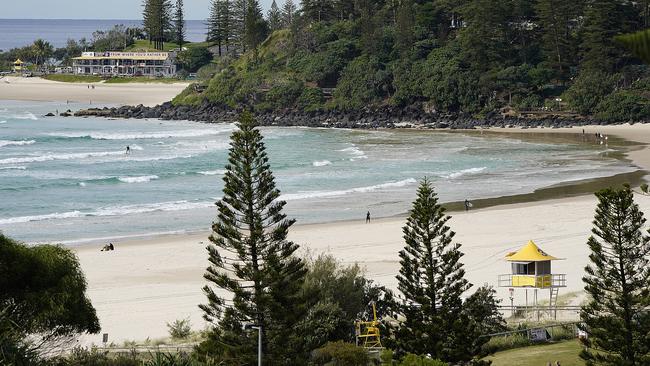 Coolangatta is usually bustling at this time of year, but barely anyone was at the beach last Friday. Picture: AAP Image/Dave Hunt