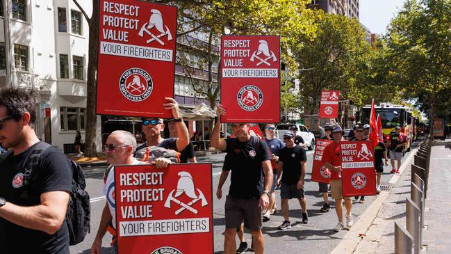 Firefighters protest at NSW Parliament as they are still waiting for a new pay deal with the government. Picture: NCA NewsWire / David Swift