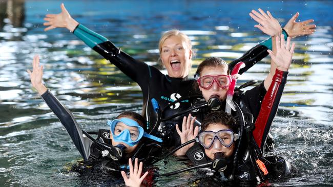 Cairns dive operator Divers Den is launching a new five-week scuba diving course for children. The Seal Team program is split into five weekly sessions in the heated pool at Divers Den’s central Cairns training centre. Maya Schnell, 11, Karim Forbes, 8 and Elyse van der Reijden, 13, are excited to start the Seal Team Program with Course director Charlotte Faulkner. Picture: STEWART McLEAN