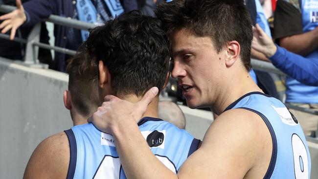 Shane McAdam and Jack Stephens console each other after Sturt’s loss to North in the SANFL first semi-final. Picture Sarah Reed