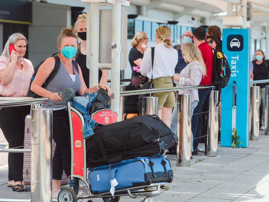 Kellie Grubb among travellers arriving in Darwin waiting for up to 20 minutes for a taxi at Darwin International Airport. Picture: Glenn Campbell