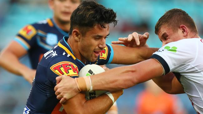 Jesse Arthars of the Titans is tackled against the Cowboys