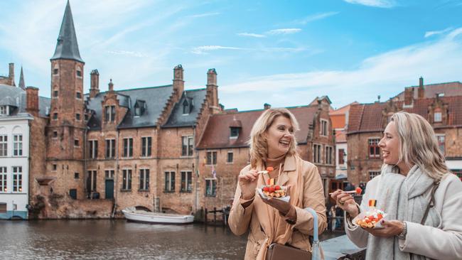 Two female friends in Bruges, Belgium.