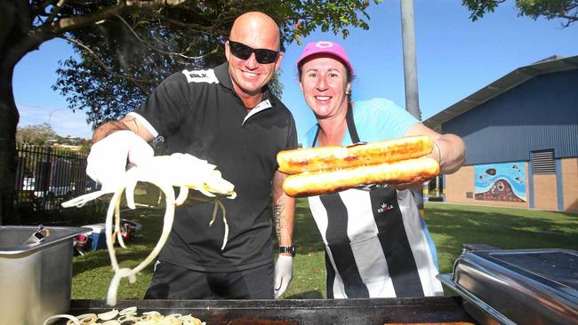 Handing the democracy sausages out at Banora Point High School are Michael and Lee-Anne Rice. Picture: Scott Powick