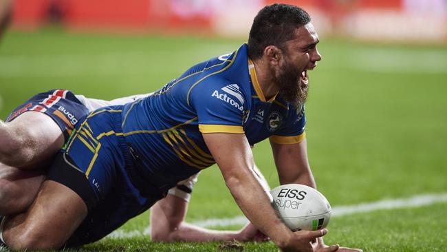 Isaiah Papali'i celebrates atry against the Roosters. Picture: Brett Hemmings/Getty Images