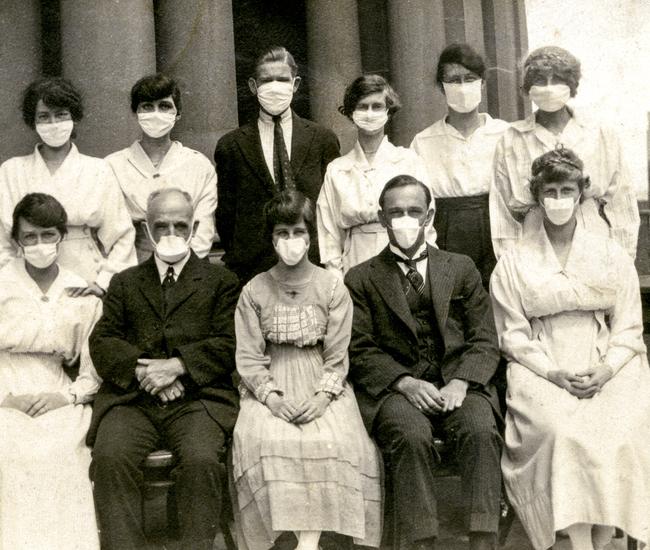 People in masks at Sydney Town Hall during the Spanish flu outbreak. Picture: City of Sydney Archives.