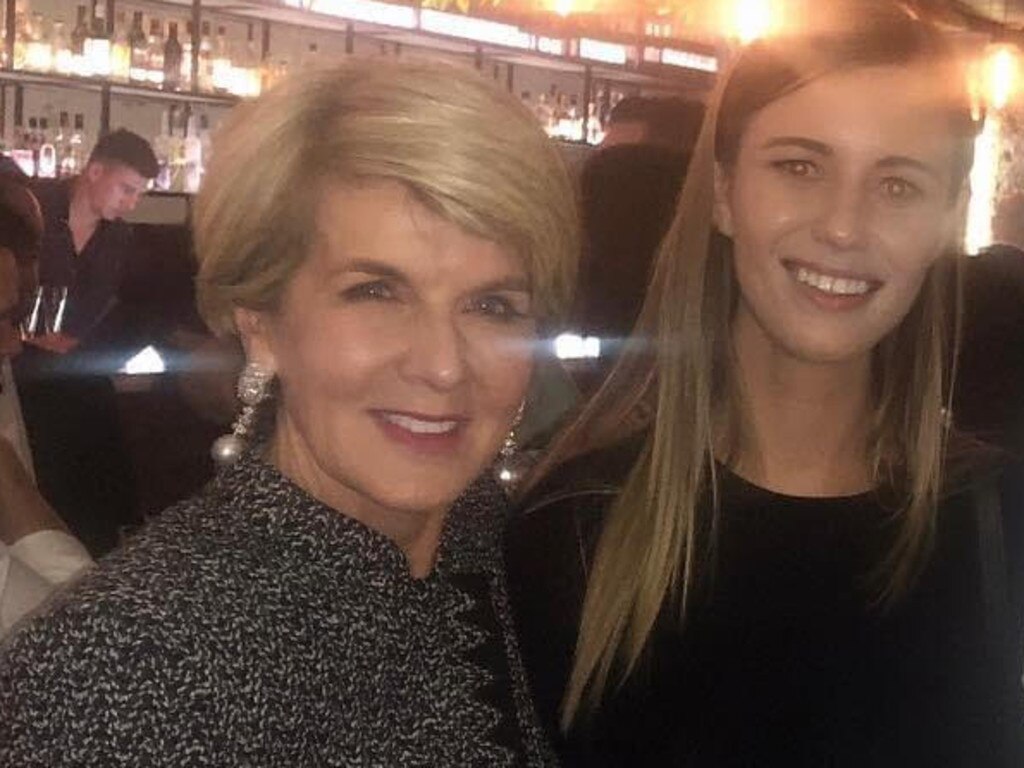 Ms Higgins, pictured with Julie Bishop, claims she felt she had to choose between going to the police and keeping her job.