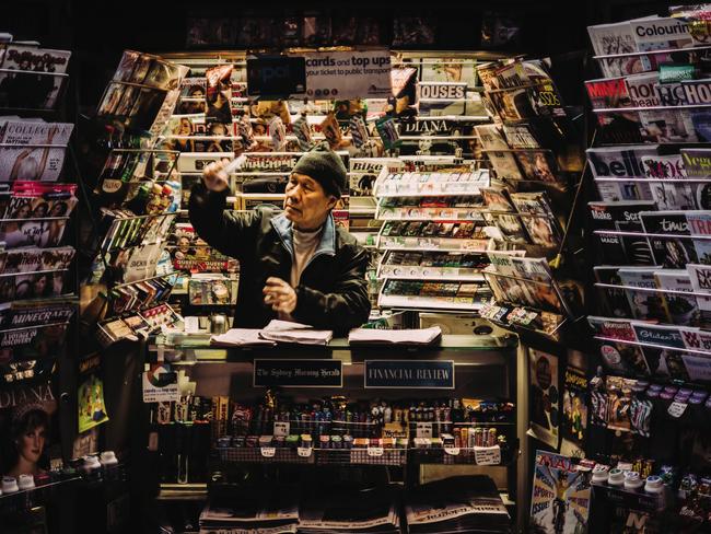 A Sydney newsagent goes about his late night work: Picture: Matt Osborne