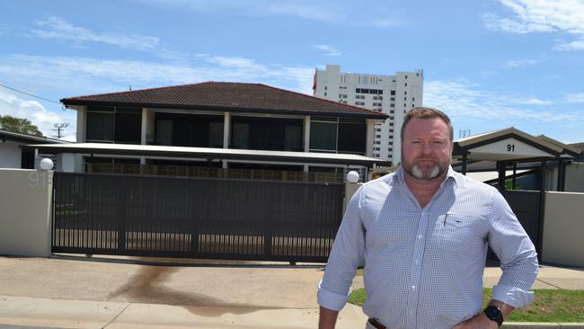 Aaron Power stands in front of the Townsville Holiday Apartments in North Ward bought by the Morris Group for just under $2m.