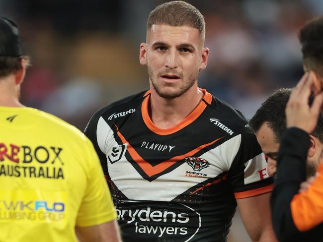 SYDNEY, AUSTRALIA - APRIL 10:  Adam Doueihi of the Wests Tigers walks from the field injured during the round six NRL match between Wests Tigers and Parramatta Eels at Accor Stadium on April 10, 2023 in Sydney, Australia. (Photo by Mark Metcalfe/Getty Images)