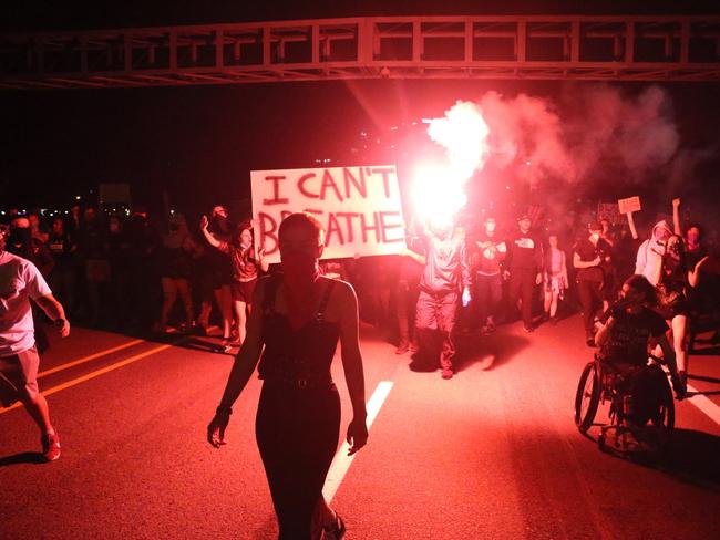 People march from the George Floyd vigil at Peninsula Park towards the Justice Center downtown in Portland. Picture: Dave Killen/The Oregonian via AP