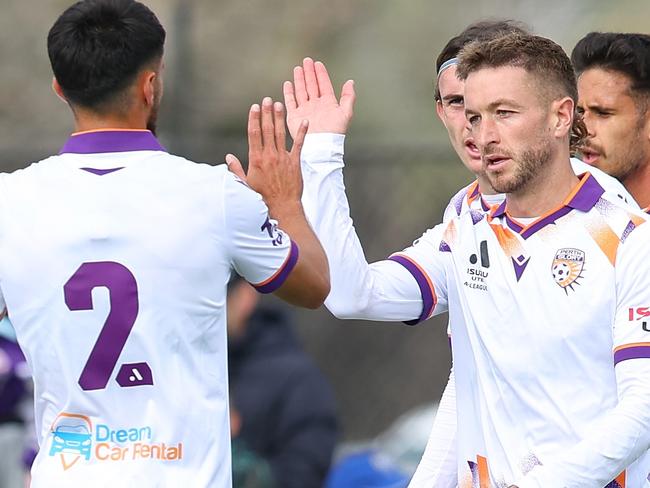 BUNBURY, AUSTRALIA - OCTOBER 01: Adam Taggart of the Glory high fives his team mates after a goal during the A-League Mens pre-season match between Perth Glory and Melbourne Victory at Bunbury Park on October 01, 2023 in Bunbury, Australia. (Photo by James Worsfold/Getty Images)